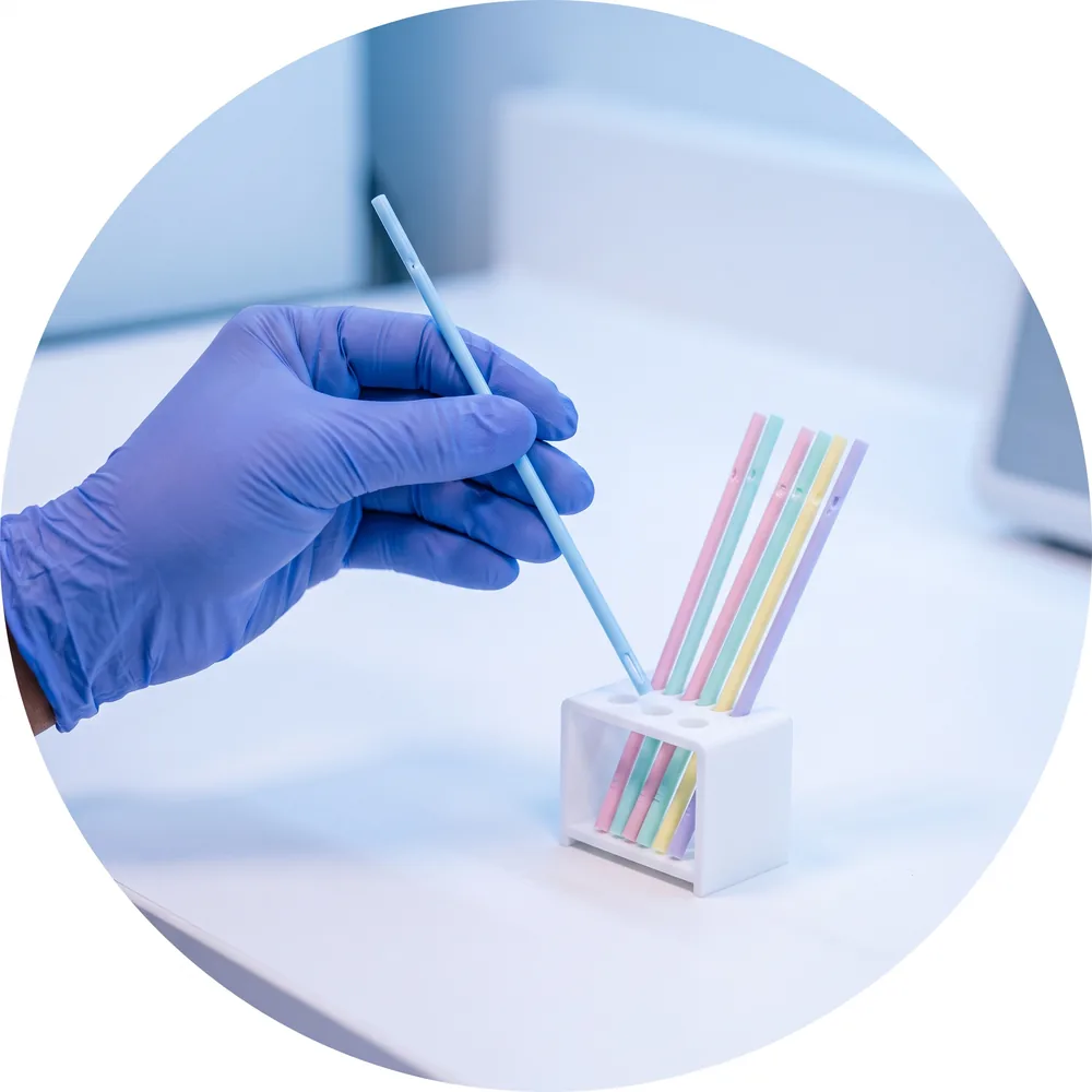 Colour-coded embryo freezing straws in a laboratory rack